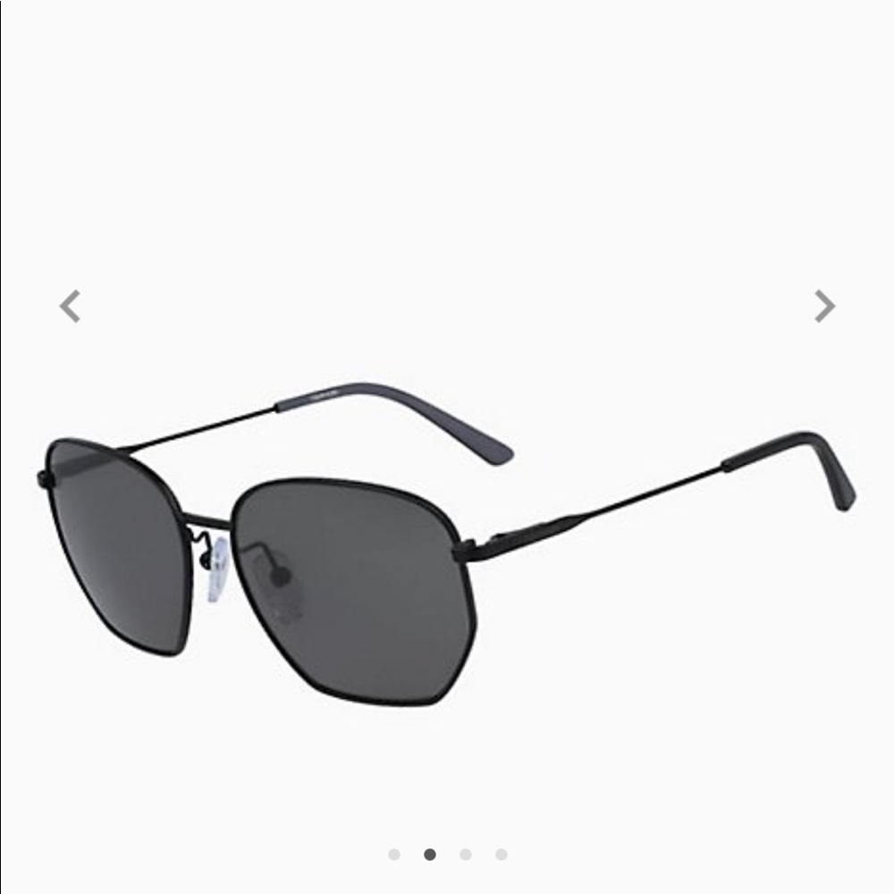 Calvin Klein unisex black matte rectangular sunglasses.